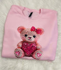 pink bear on pink sweatshirt